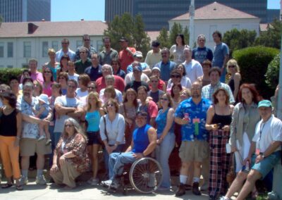 30th reunion picnic group photo on high school front lawn by flagpole.