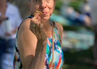 Beverly Hills High School Class of 1974 45th reunion at Roxbury Park. Valerie Lehrer eating a cooking with an amazing smile on her face.