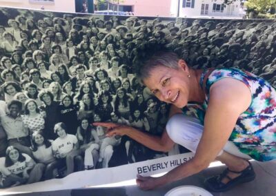 Beverly Hills High School Class of 1974 45th reunion at Roxbury Park. Valerie Lehrer pointing at herself in the big class of 1974 picture.