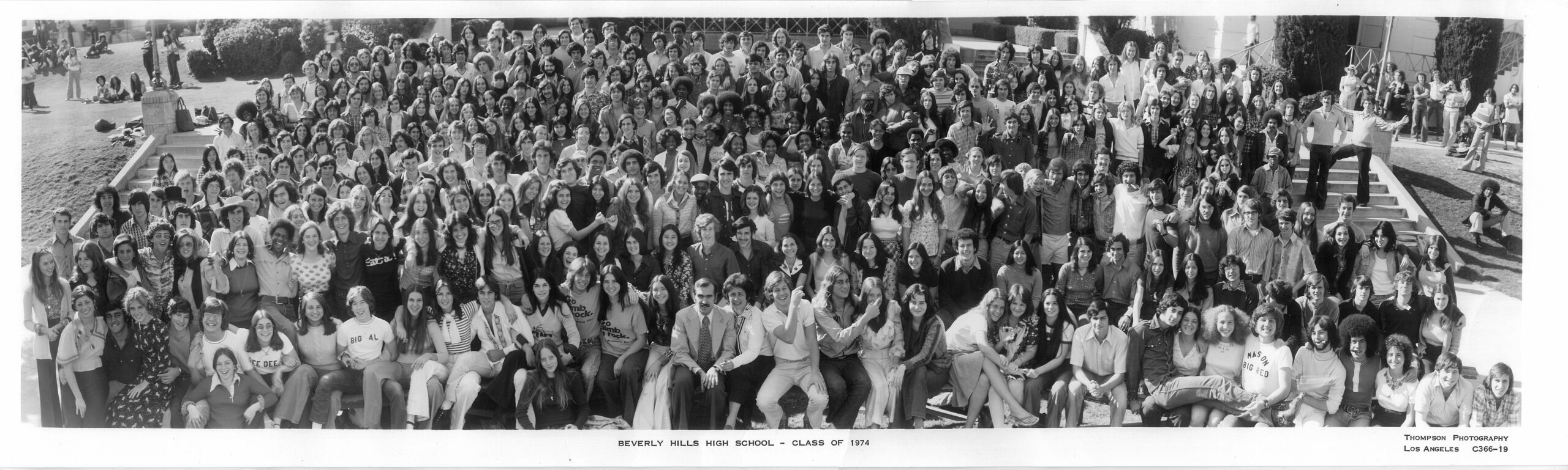 The senior class photograph of the class of 1974. This picture is on the front lawn of Beverly Hills High School. There are more than 600 people in the photograph. This is the photo that we like to look at when we are at our reunions.