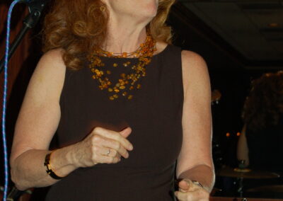 40th reunion at Maggiano's, pictured is Pamela Rose performing on stage with her band.