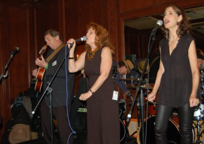 40th reunion at Maggiano's, pictured are Carey Appel, Pamela Rose singing with the band. David Freshman is playing guitar.