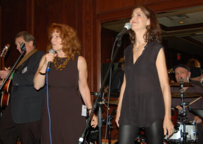 40th reunion at Maggiano's, pictured are Carey Appel, Pamela Rose singing with the band. David Freshman is playing guitar.