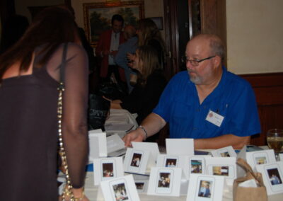 40th reunion at Maggiano's, pictured is Mark Sheppard surrounded by photograph cards.