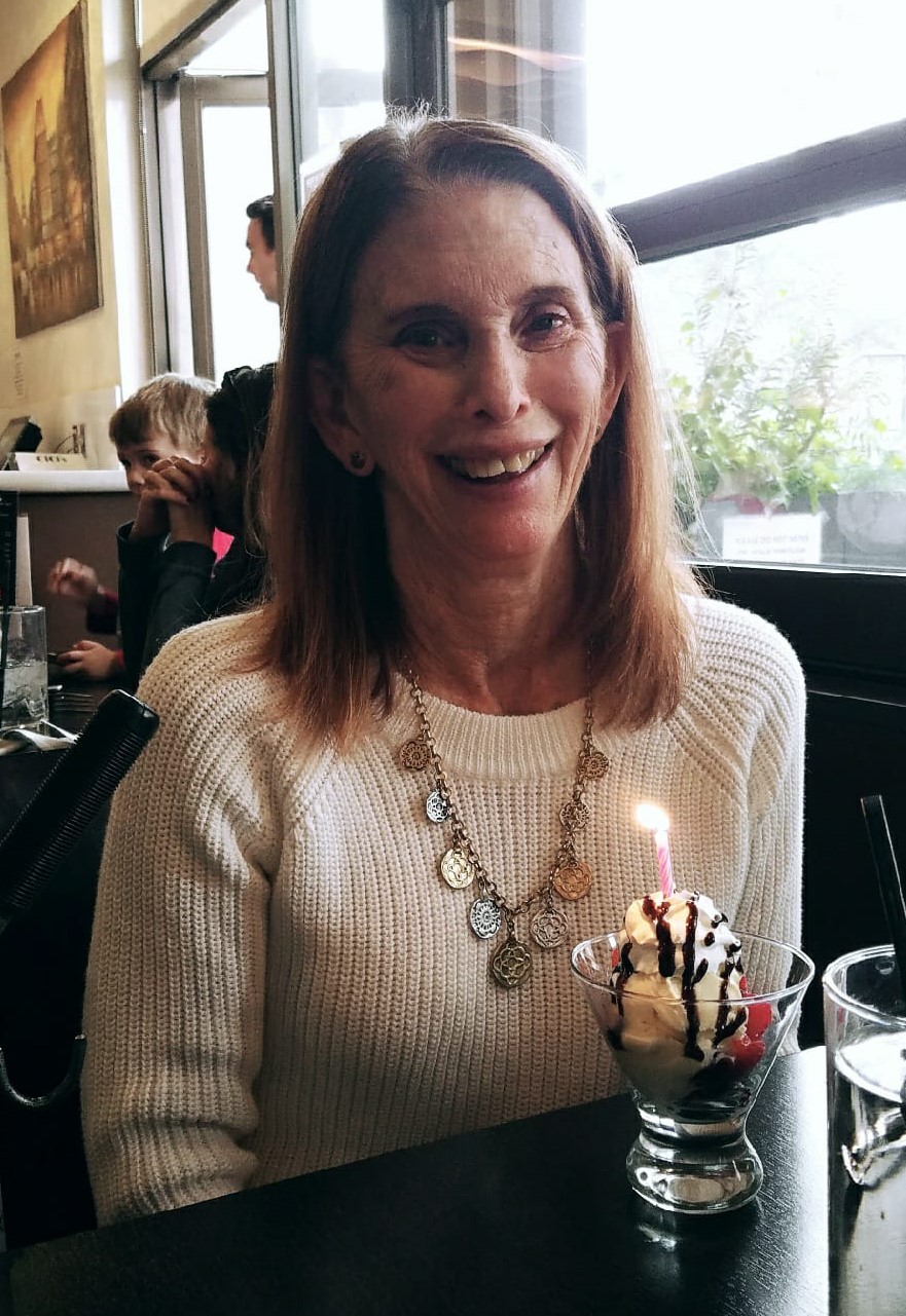 Stacey Desser-Lebowitz enjoying an ice cream sundae at an early birthday for her.